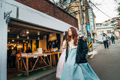 Woman in traditional clothing in city