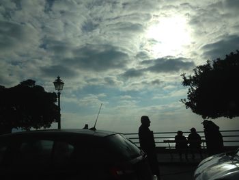 View of street light against cloudy sky