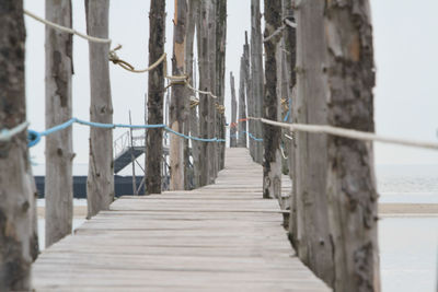 Footpath by railing against sea