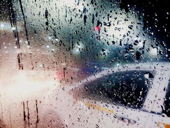 Full frame shot of wet glass window in rainy season