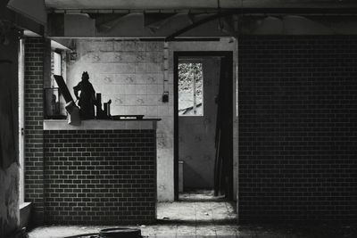 Full length of woman walking on tiled floor
