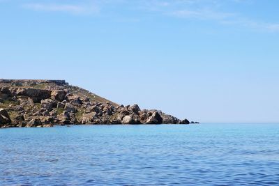 Scenic view of sea against clear blue sky