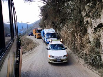 Cars on road against sky