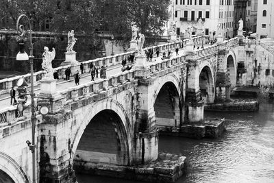 Arch bridge over river in city