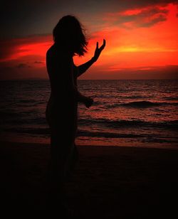 Scenic view of sea at sunset