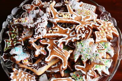 High angle view of fresh gingerbread cookies in bowl at home