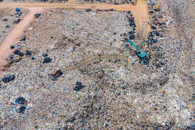 High angle view of land vehicle at garbage dump