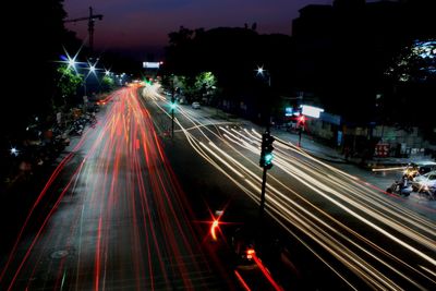 High angle view of light trails on city street at night