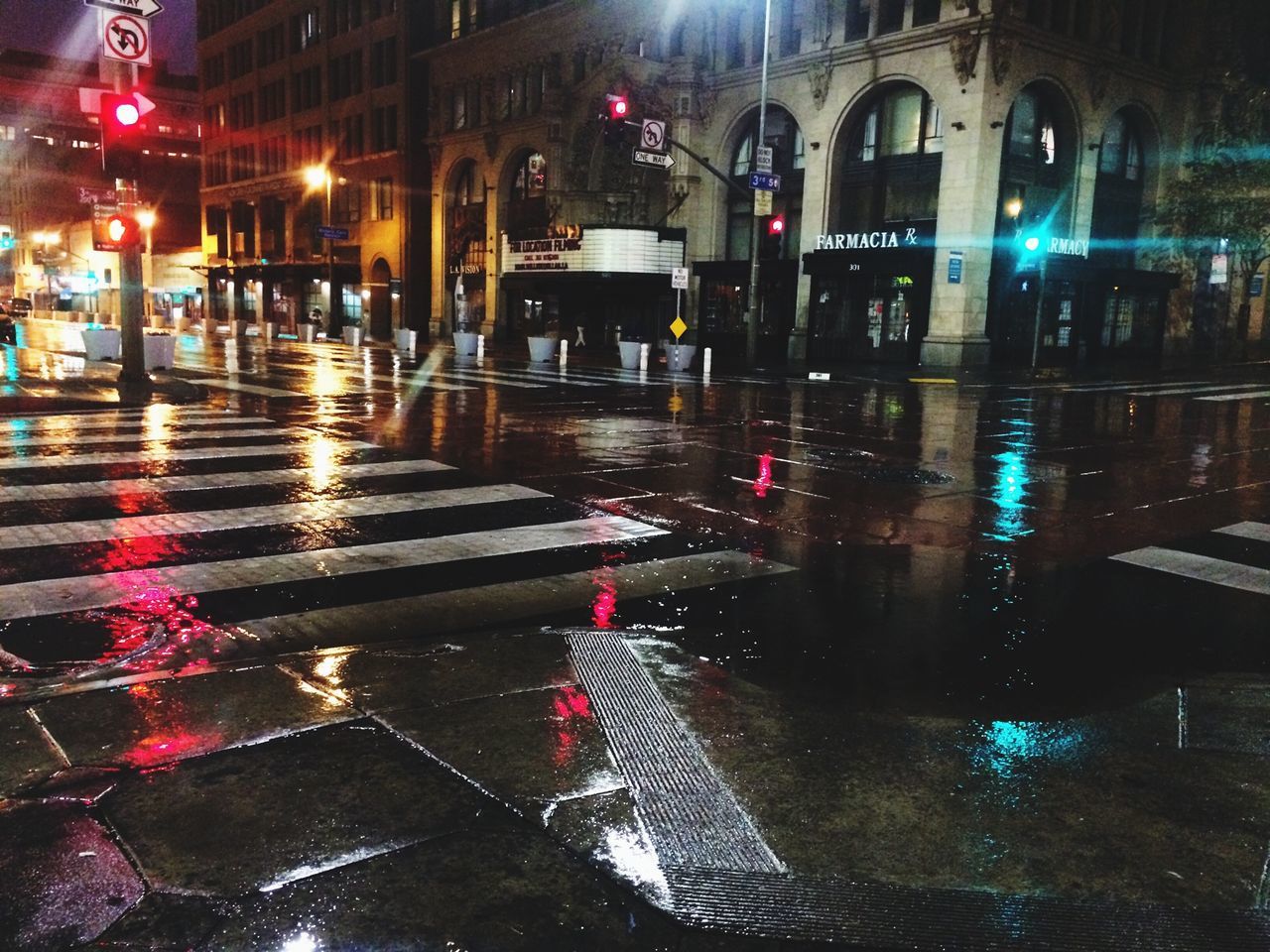 illuminated, night, architecture, building exterior, built structure, wet, street, water, reflection, street light, rain, city, lighting equipment, transportation, the way forward, road, city life, incidental people, city street, car