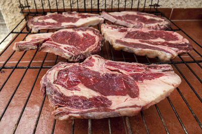 High angle view of meat on barbecue grill