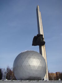 Low angle view of statue against sky
