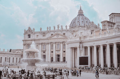 Group of people in front of historical building