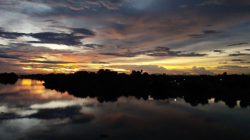 Scenic view of lake against sky during sunset