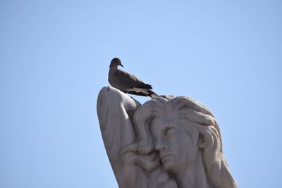 Low angle view of statue against clear sky