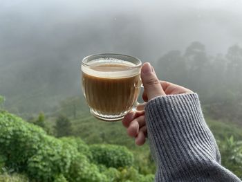 Man holding coffee cup
