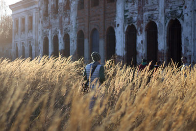 Woman in front of built structure