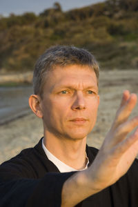 Man doing martial arts at beach