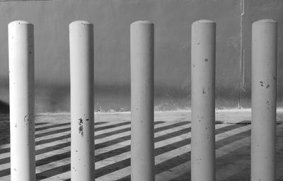 Row of metal railing on beach