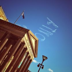 Low angle view of building against blue sky