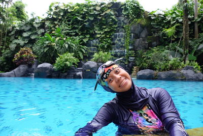 Portrait of young woman in water