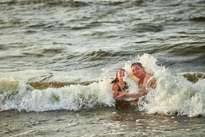 High angle view of man surfing in sea