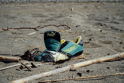 High angle view of shoes on sand