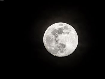 Low angle view of moon against sky at night