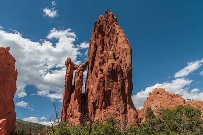 Low angle view of rock formation against sky