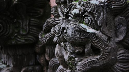 Close-up of statue against old building