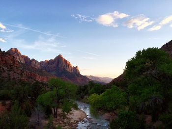 Scenic view of mountains against cloudy sky