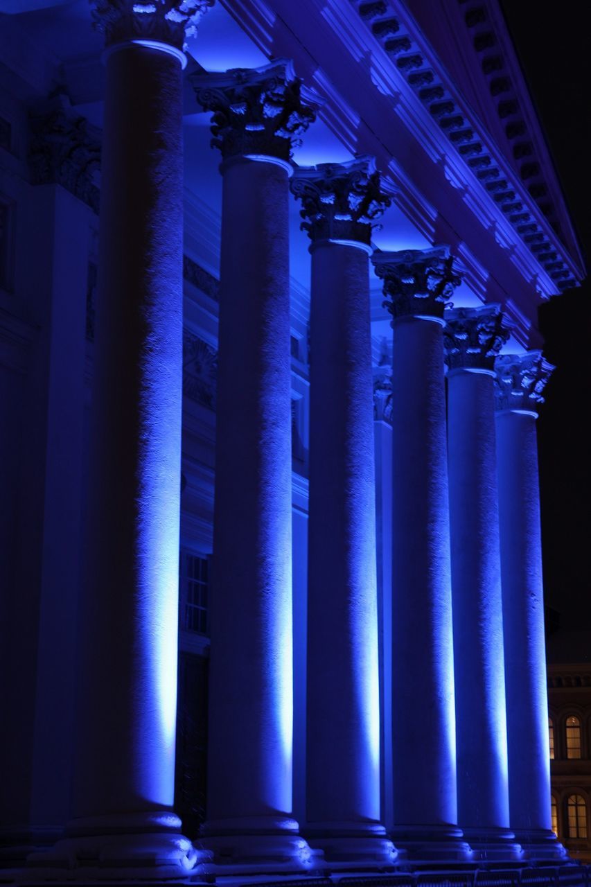 LOW ANGLE VIEW OF ILLUMINATED BLUE LIGHTS AT NIGHT