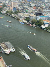 High angle view of river amidst buildings in city