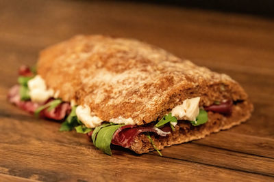 Close-up of sandwich on cutting board