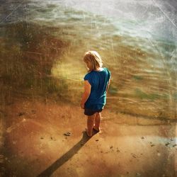 Full length of boy in pond