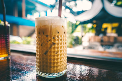 Close-up of beer glass on table