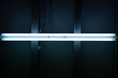 Full frame shot of illuminated wall in darkroom