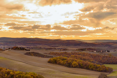 Scenic view of landscape against sky during sunset