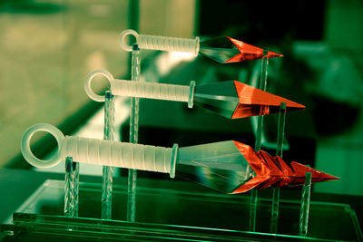 Close-up of artistic glass knives in museum