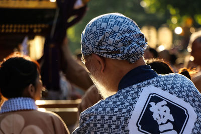 Rear view of man standing in japanese festival
