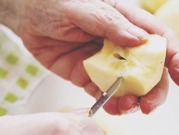 Midsection of person holding fruit