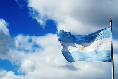 Low angle view of argentina flag against the sky