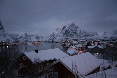 Scenic view of lake against sky during winter