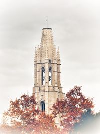 Low angle view of bell tower against sky