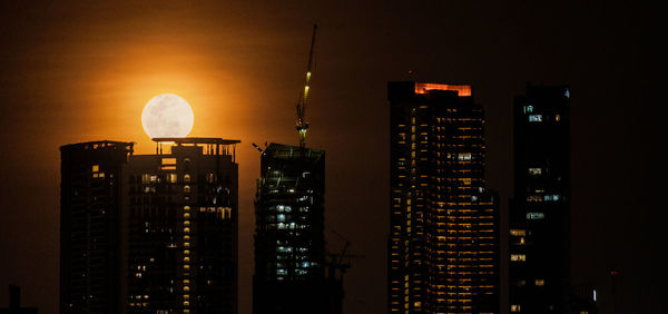 Illuminated buildings in city at night