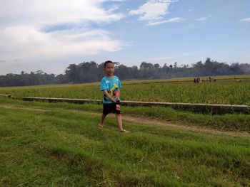 Full length of man on field against sky