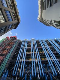 Low angle view of modern buildings against sky