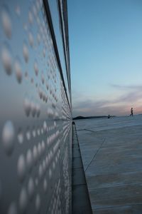 Building against sky at sunset