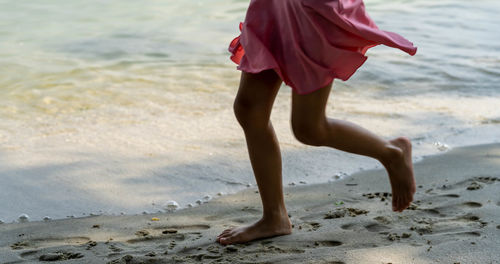 Low section of woman on beach