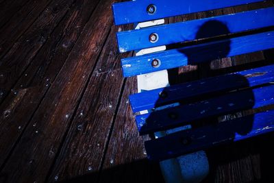 Bench shadow on pier