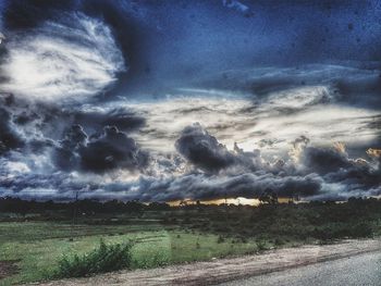 Scenic view of dramatic sky over land